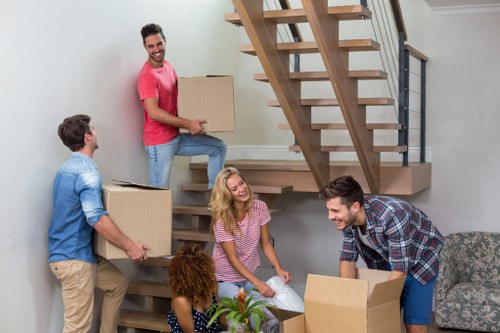 Local removals team handling furniture and boxes