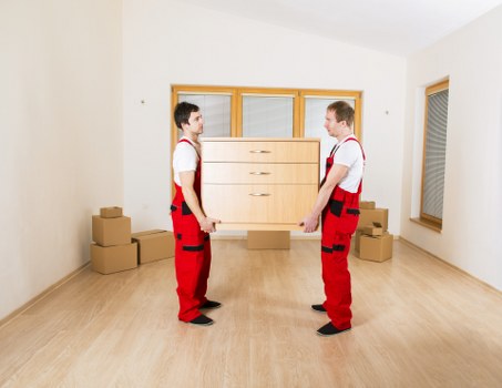 Furniture and boxes being loaded into a moving van in West Ealing
